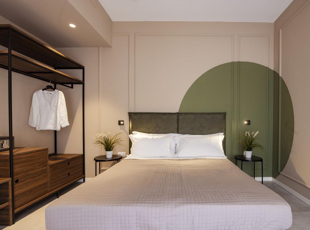 Modern, cozy bedroom with warm colors and elegant details.
